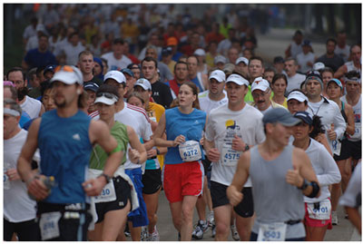 A picture of a large group of people running in a marathon.