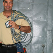 electrician carrying electrical conduit