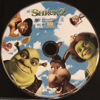 A photograph of the DVD “Shrek 2.” It has images of the cast on it.