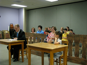 A photograph of a children's jury in a courtroom