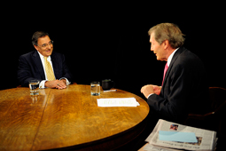 A photograph of talk show host Charlie Rose speaking with Defense Secretary Leon Panetta.