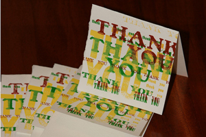 A photograph of a stack of “Thank You” cards