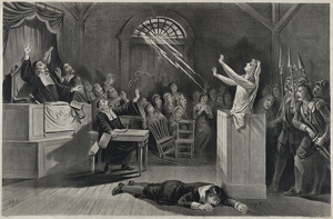 Picture shows a young woman in Salem, MA, on trial for being a witch.