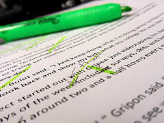Highlighter resting on a well-edited page