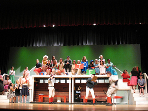 A photograph of a school play being performed on a stage.