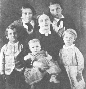 Image of Mary Adams Maverick holding an infant and surrounded by her children