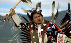 Image of an American Indian dressed in ceremonial dress