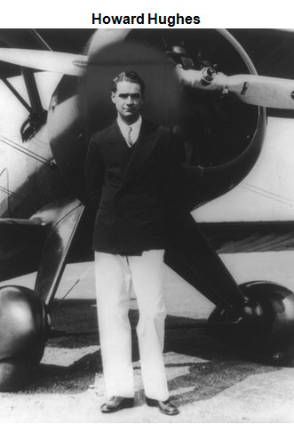 Image of Howard Hughes standing in front of an airplane