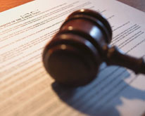 Image of a document with a gavel resting on top of it