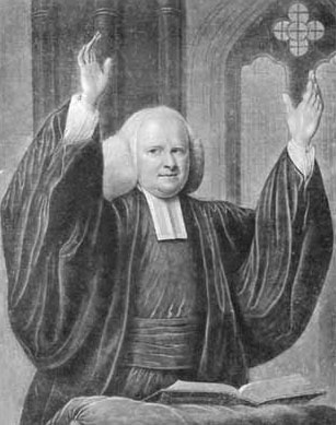 Image of George Whitefield, hands raised and holding a bible