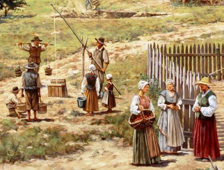 Portrait of group colonists, men, women, and children near a water well.