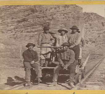 Image of Chinese workers on the Railroad tracks. 