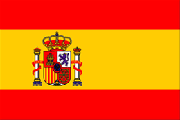 The Spanish Flag, which has a red, yellow, and red stripe and the Spanish coat of arms in the center-left.