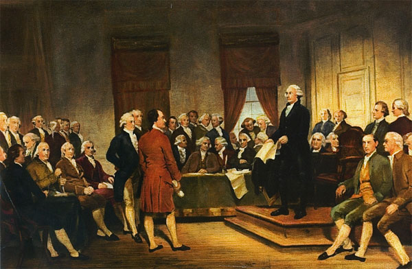 A room of men in colonial dress seated around a tall man in a white wig wearing a black suit