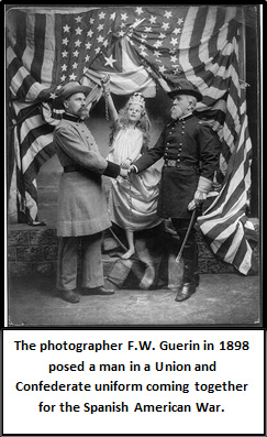 A black and white photo of a man in a gray uniform shaking hands with a man in a dark military uniform in front of a girl in a white robe with a crown with an American flag draped in the background