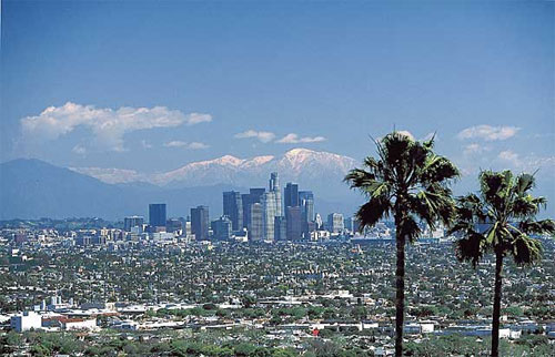 Photo of the city of Los Angeles, featuring the skyline and the mountains in the background.