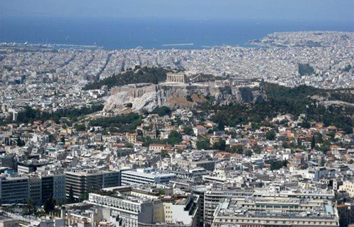 Image of The Acropolis, a flat-topped rock about five hectares in area, overlooks the sprawling city of Athens.