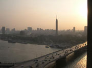 A view of Cairo from the Nile with the Cairo Tower, a free standing TV tower on Gezira Island, in the foreground