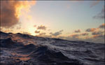 Image of waves on the ocean at sunset