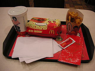 Image of a boxed meal, a box of fries, and cup