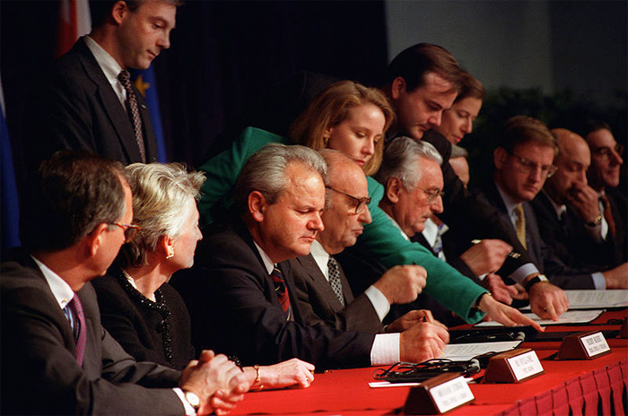 Photo of President Slobodan Milosevic of the Federal Republic of Yugoslavia, President Alija Izetbegovic of the Republic of Bosnia and Herzegovina, and President Franjo Tudjman of the Republic of Croatia initial the Dayton Peace Accords.