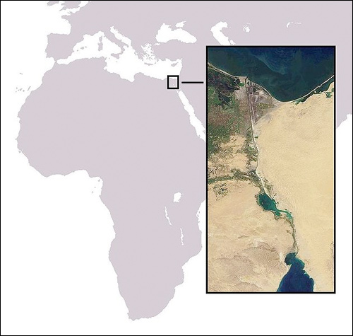 A map of Africa and the Middle East (Jordan, Israel, and Saudi Arabia) with an inlay photograph of the Suez Canal taken from space.