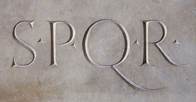 A carved relief of the letters S.P.Q.R. that stands for the Senate and the People of Rome.