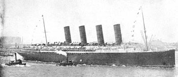Photograph of the RMS Lusitania, a large passenger ship with four smoke stacks.