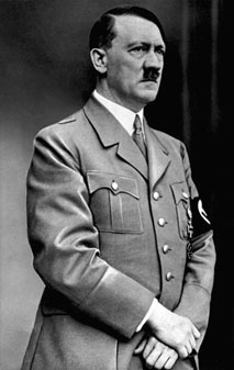 Image of Adolf Hitler standing in his uniform.