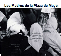 Image of three older women seated with their backs to the camera. Each is wearing a white scarf, a symbol of the Madres cause.