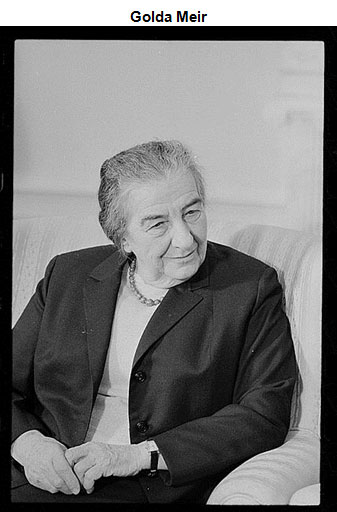 Image of Golda Meir seated with hands clasped on her lap.