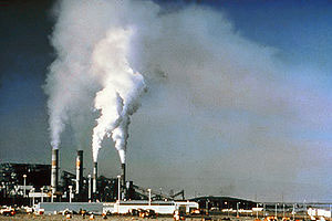 image is smoke coming from smoke stacks in a factory