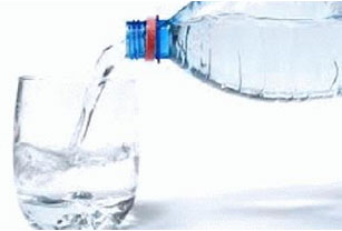 Image is of a water bottle and a glass of water