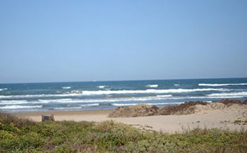Image is of a beach and ocean
