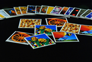 photo of a group of colorful note cards spread across a black tablecloth