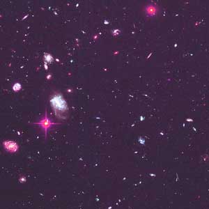 astrophotography of a night sky showing galaxies, stars, and planets