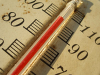 A photograph of thermometer mercury heading above 100 degrees on the scale
