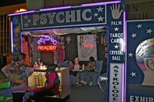 A photograph of the outside of a psychic reader's booth.