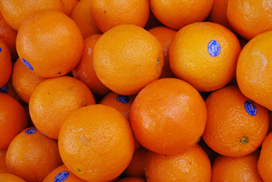 A photograph of a pile of oranges