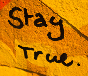 A graphic that reads “Stay True.”