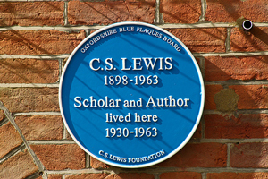 A photograph of a plaque outside of C.S. Lewis' house.