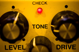A photograph of a tone knob on an effects pedal.