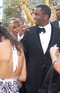 A photograph of entertainer P Diddy at a formal event. He is wearing a tuxedo.
