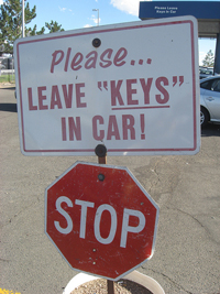 A sign in a parking lot that reads; “Please leave “keys” in car!” There are quotation marks around the word keys which is an odd use of quotation marks.
