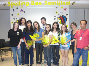 A photograph of the semi-finalists in a spelling bee posing for a group photo.