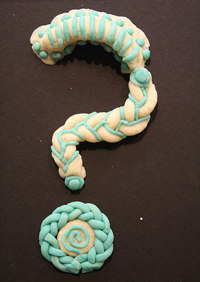 A photograph of a playdough question mark.