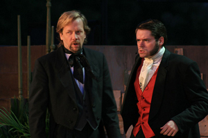 A photograph from a stage production of the play Dr. Jekyll and Mr. Hyde. It shows two gentlemen talking. They are wearing formal attire typical of men in the late 19th century.