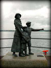 A statue of an Irish immigrant mother and her two boys about to board a ship that will take them to the US.