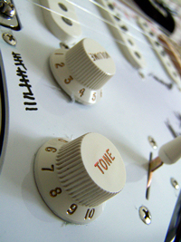 A photograph of the Tone knob on an electric guitar