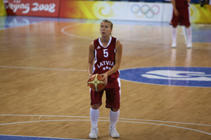 A member of the Latvian Olympic team gets ready to throw in a basketball game